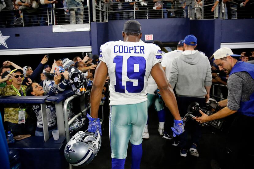 Dallas Cowboys wide receiver Amari Cooper (19) leaves the field after scoring the...