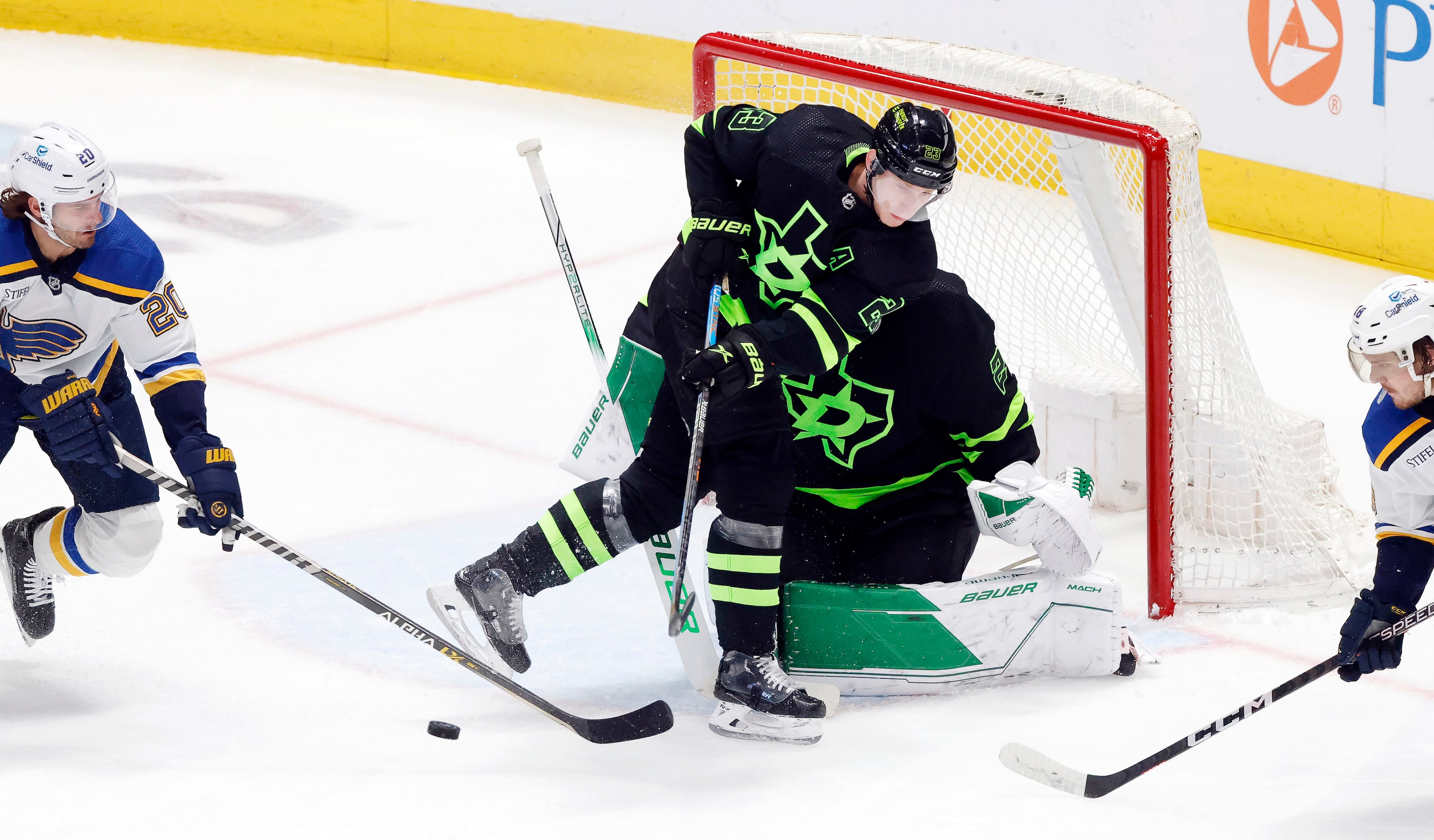 Dallas Stars defenseman Esa Lindell (23) clears a shot on goaltender Jake Oettinger (29)  by...