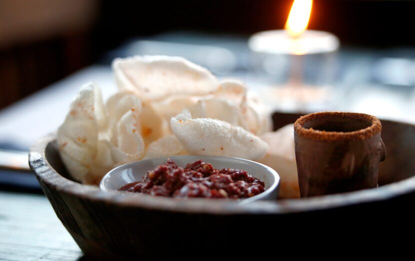 Shrimp chicharrones with salsa rojo and a cup of mescal at the Capri (Guy Reynolds/The...