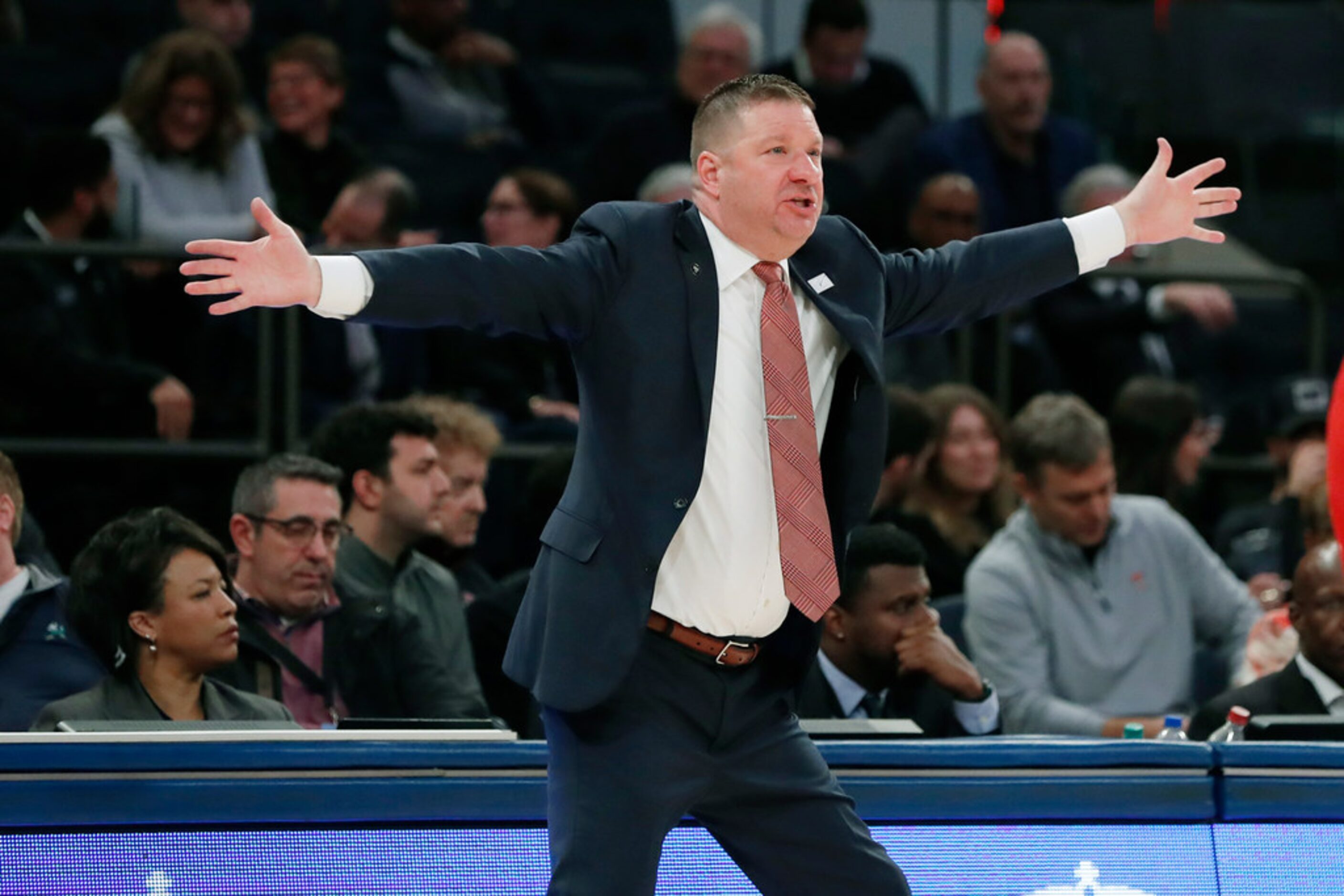 Texas Tech head coach Chris Beard gestures during the first half of an NCAA college...