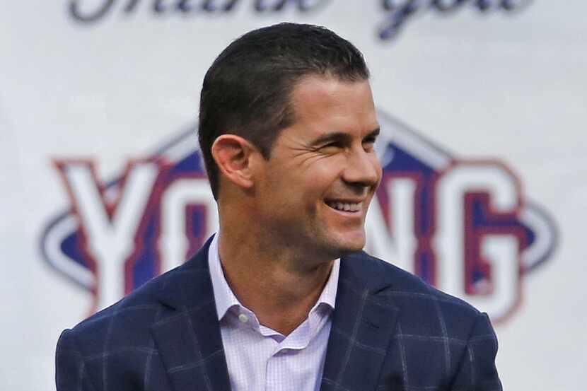 Former Texas infielder Michael Young is all smiles during a ceremony paying tribute to the...