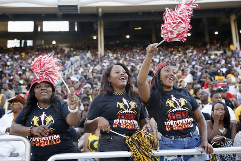 (From left) Grambling fans cheer during the 2014 State Fair Classic game at the Cotton Bowl,...