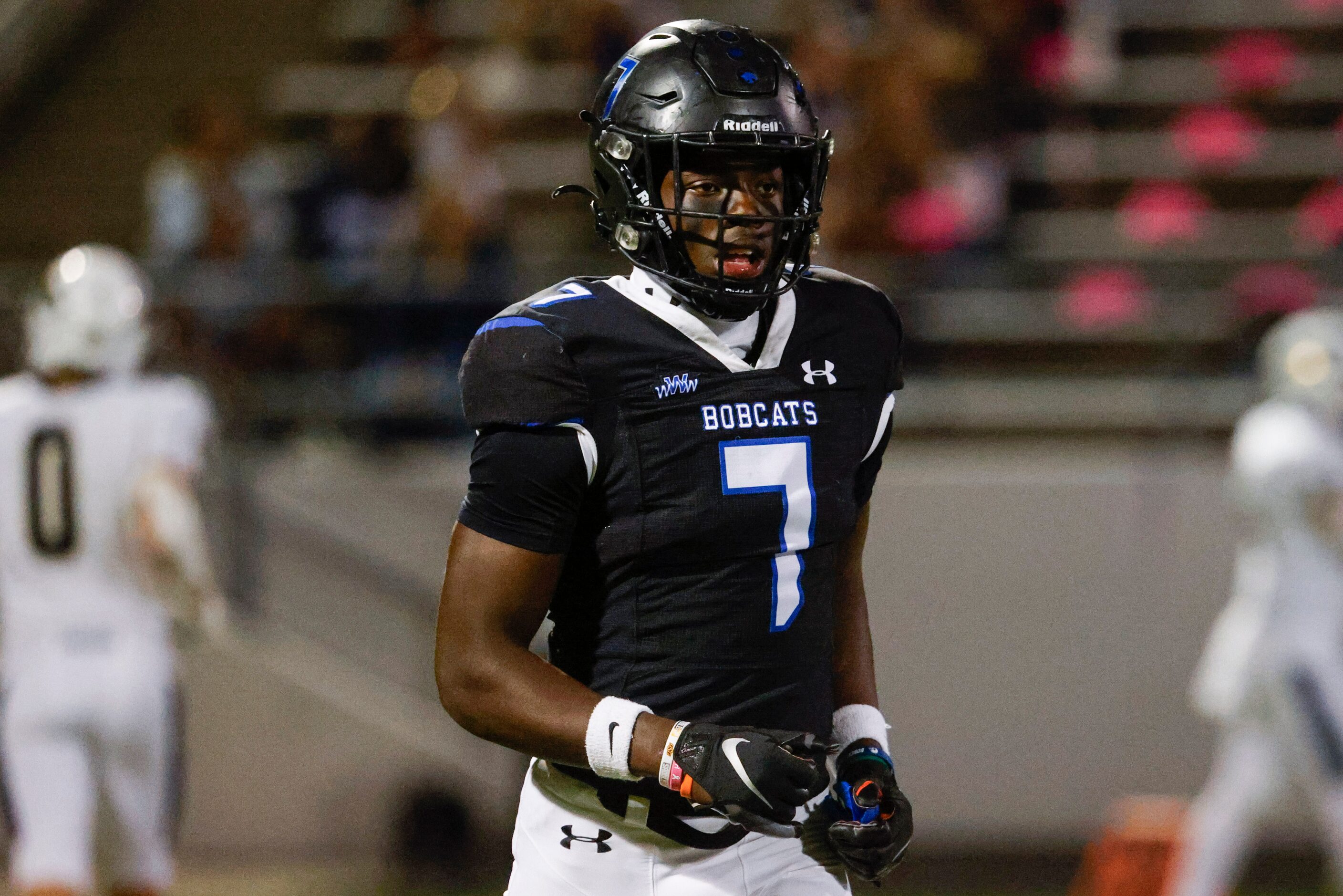 Byron Nelson’s David Kabongo (7) walks off the field during the second half of a football...