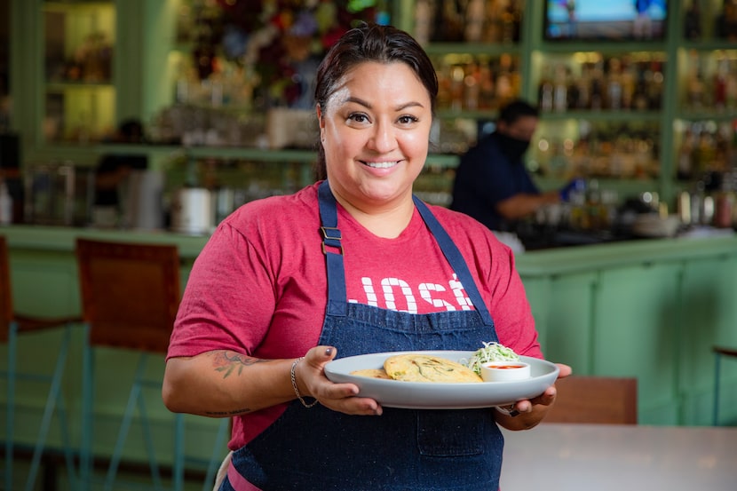 Head Chef Anastacia Quinones Pittman of Jose restaurant with a plate of pupusas 