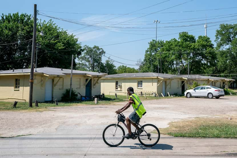 A cyclist rides past an apartment complex on Haskell Avenue Wednesday, June 29, 2022 at in...