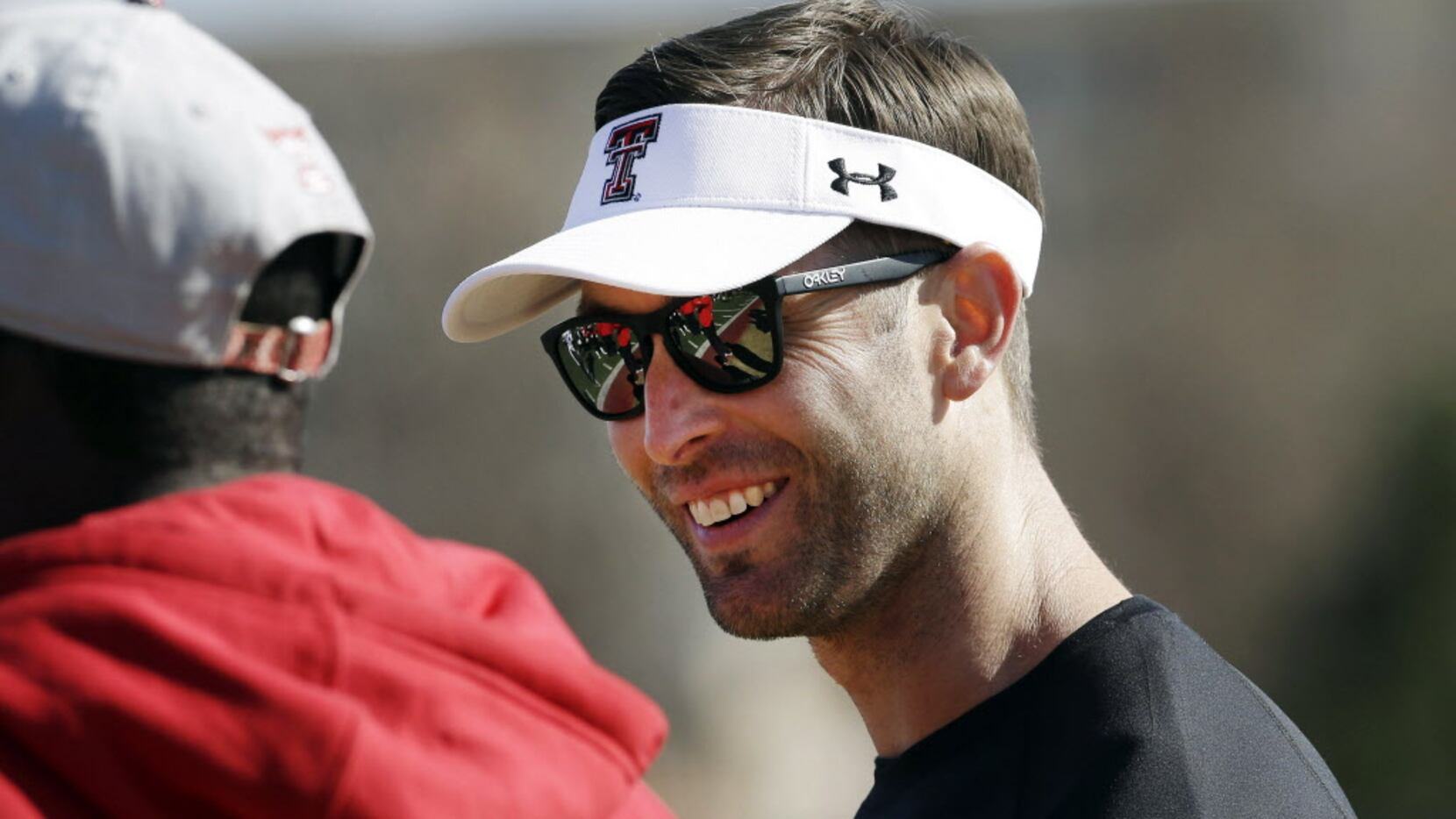 FILE - In this March 24, 2013, file photo, Texas Tech head coach Kliff Kingsbury visits on...