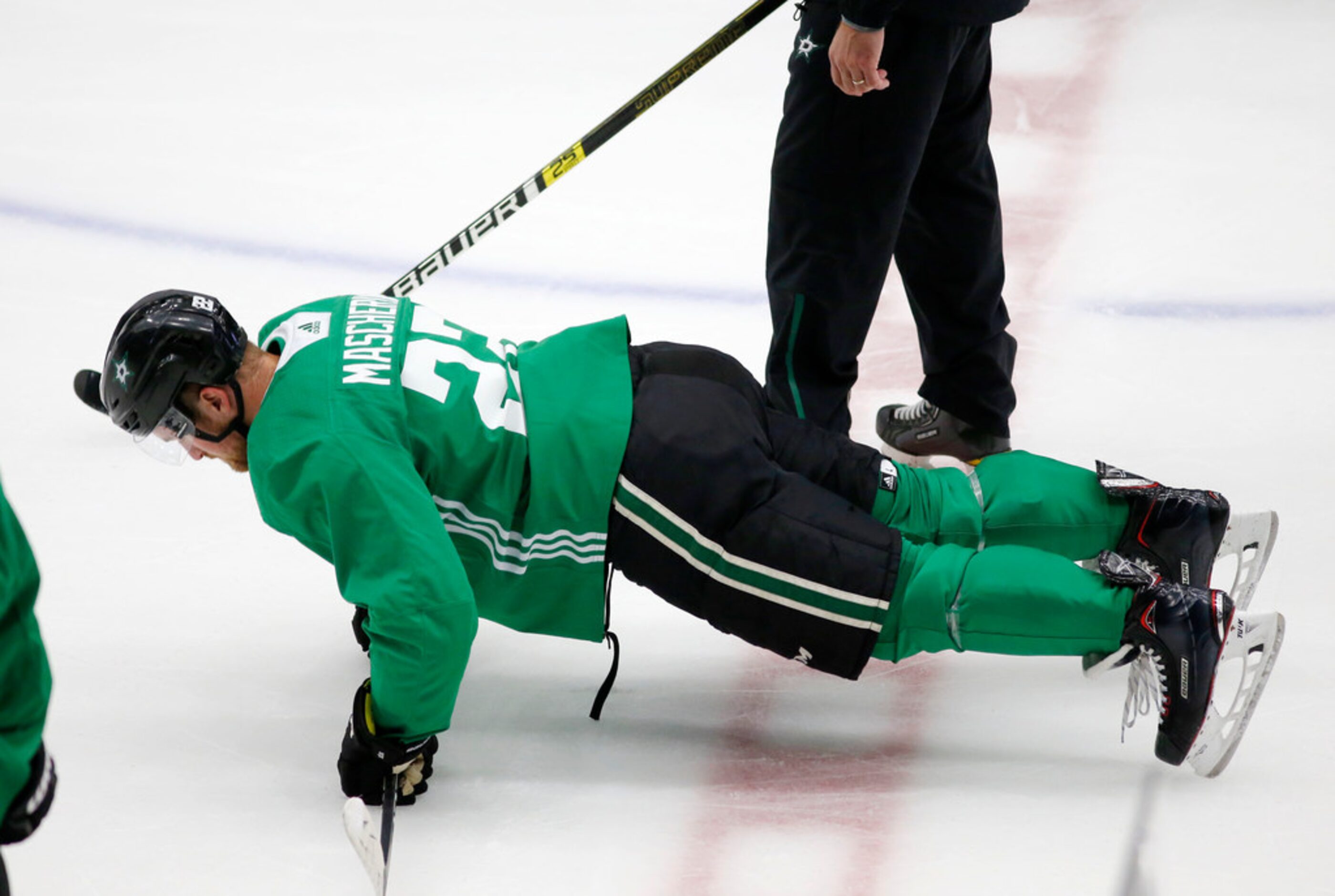 Dallas Stars Adam Mascherin (22) does pushups after a drill during Dallas Stars training...