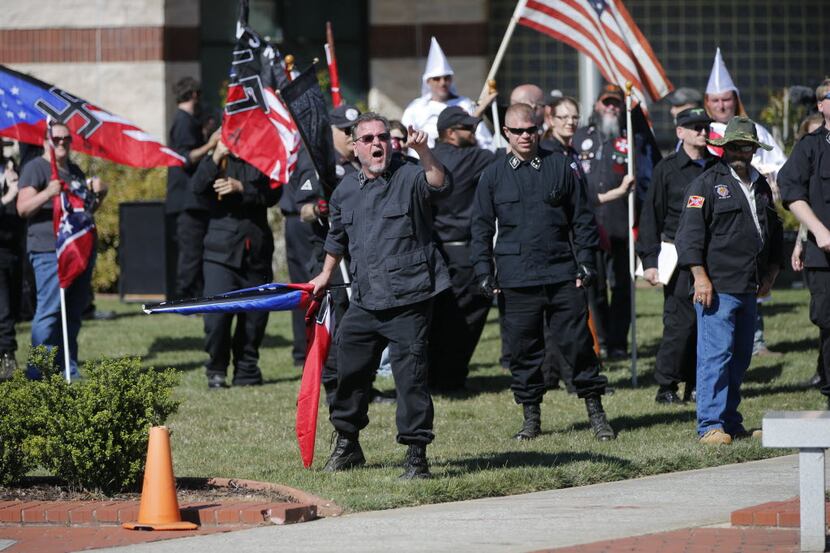 Members of a neo-Ku Klux Klan group participated in a "white pride" rally in Rome, Ga., in...