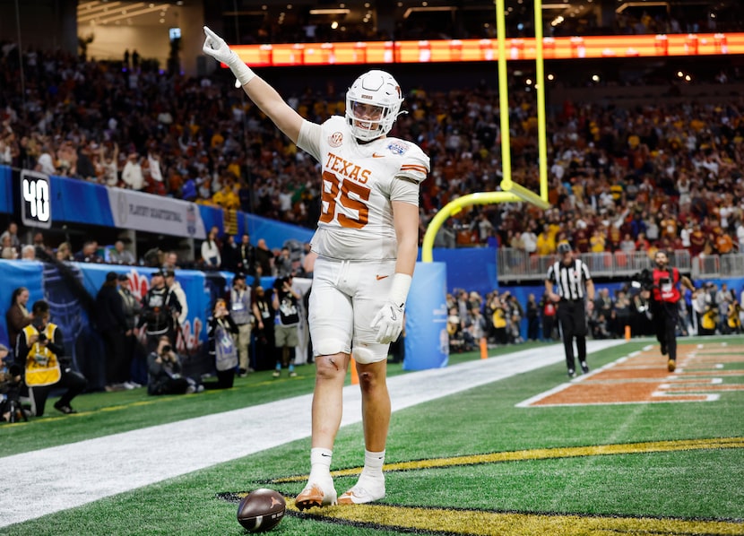 Texas Longhorns tight end Gunnar Helm (85) celebrates his double overtime touchdown catch...