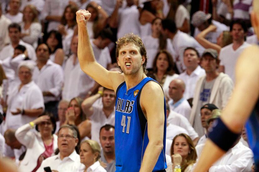 Dallas Mavericks power forward Dirk Nowitzki (41) reacts after they defeated the Miami Heat...
