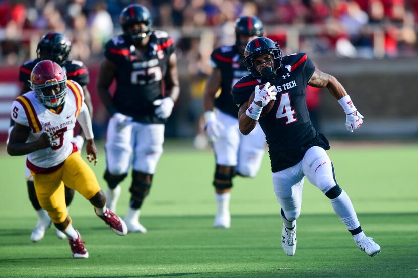 LUBBOCK, TX - OCTOBER 10: Justin Stockton #4 of the Texas Tech Red Raiders breaks free for a...