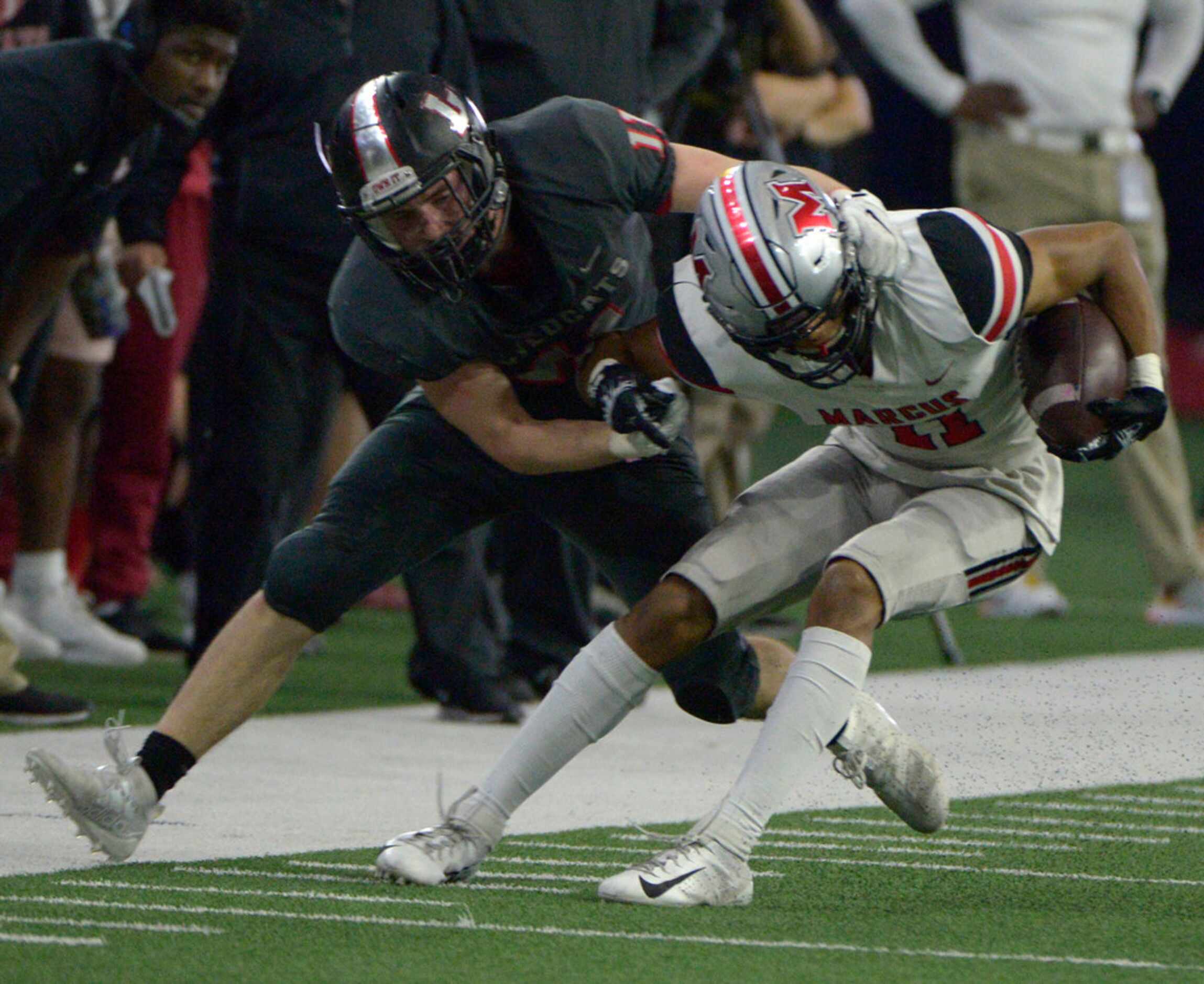 Lake Highlands' Graham Lavender (11) makes the tackle on Flower Mound Marcus' Dallas Dudley...