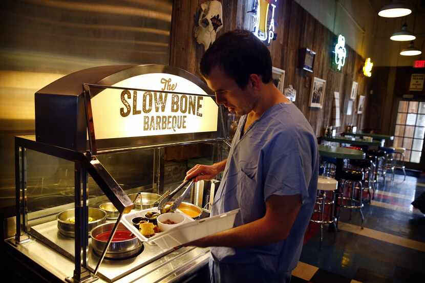 The condiment bar at Slow Bone on Irving Blvd in Dallas, Thursday, July 18, 2013. (Tom...