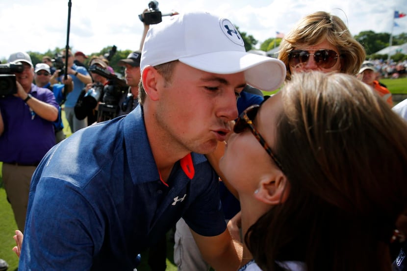 Jordan Spieth gives his girlfriend Annie Verret a kiss after winning the Dean and Deluca...