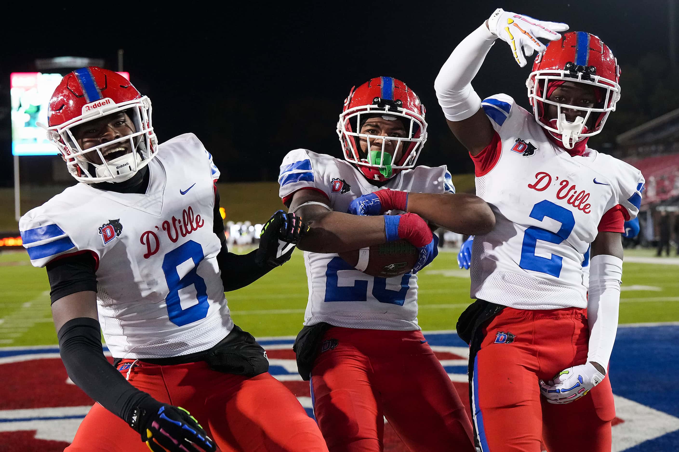 Duncanville linebacker Vernon Grant (20) celebrates with linebacker Colin Simmons (8) and...