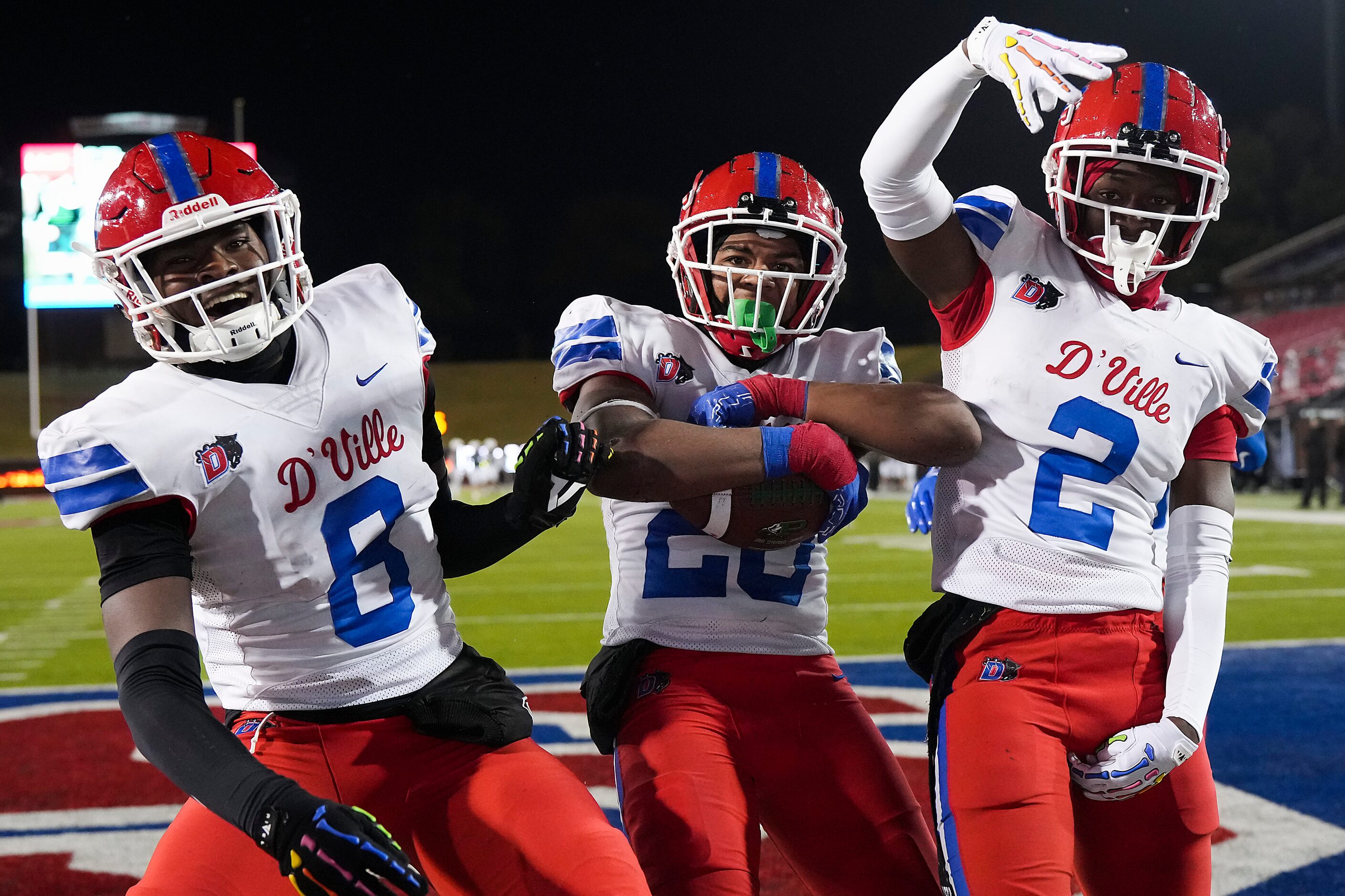 Duncanville linebacker Vernon Grant (20) celebrates with linebacker Colin Simmons (8) and...