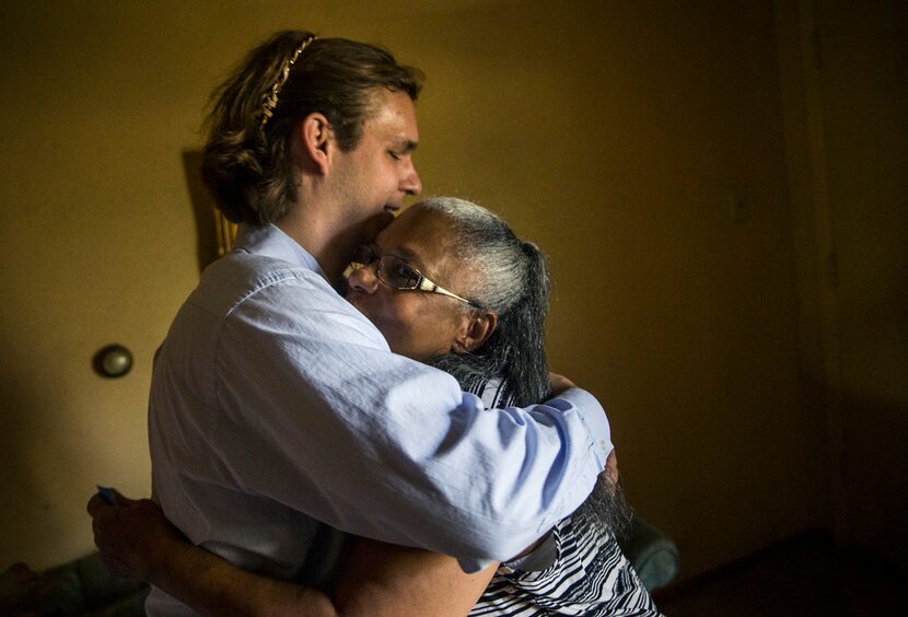 Belinda Darden embraces tax consultant Will Toler at her Hamilton Park home Monday in Dallas. 