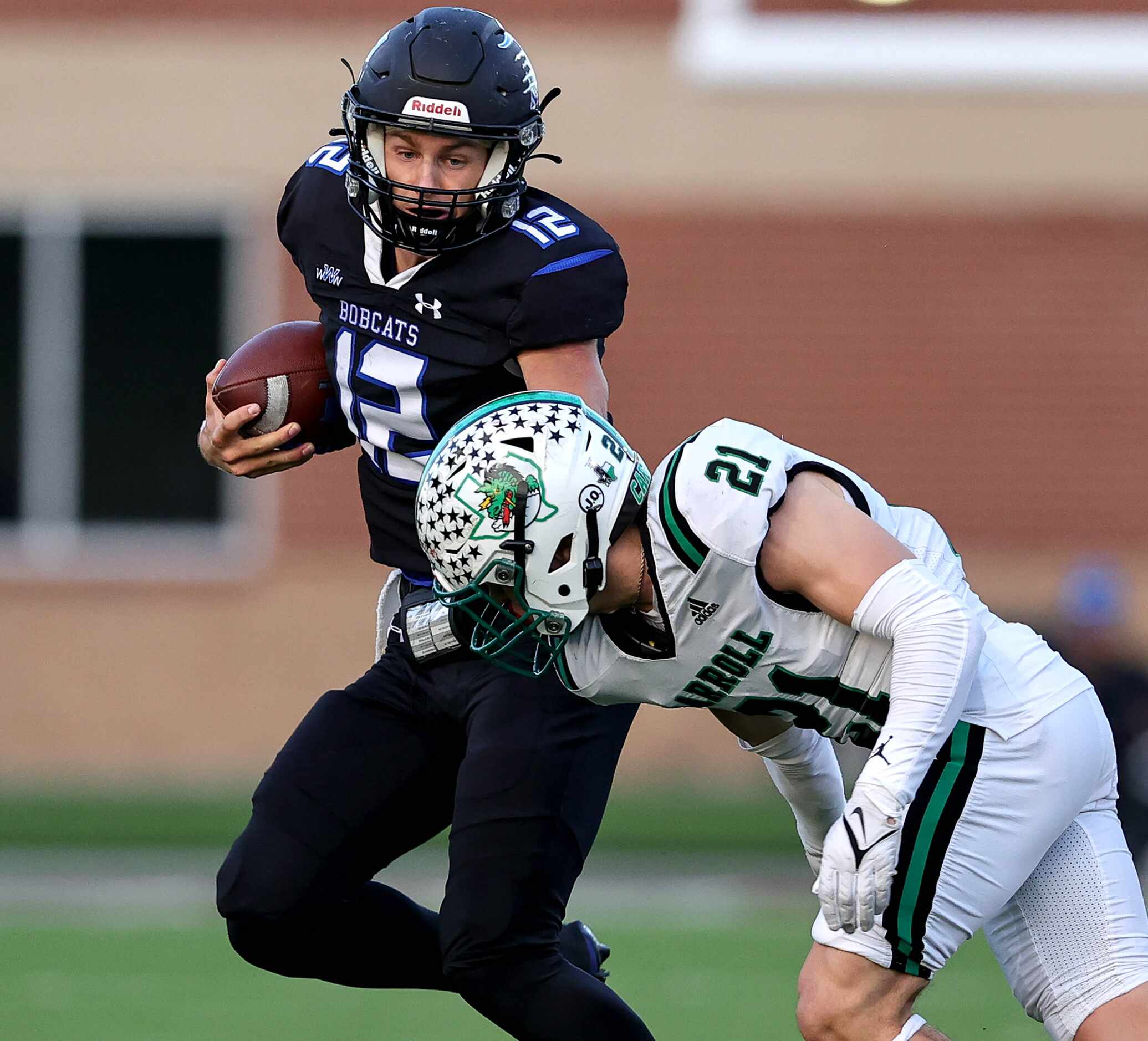Byron Nelson quarterback Tom Von Grote (12) tries to get to the corner against Southlake...