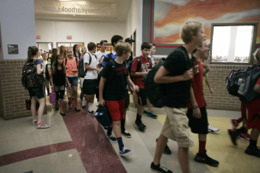 Dallas-area students walked to their first class on the first day of school in August. Some...