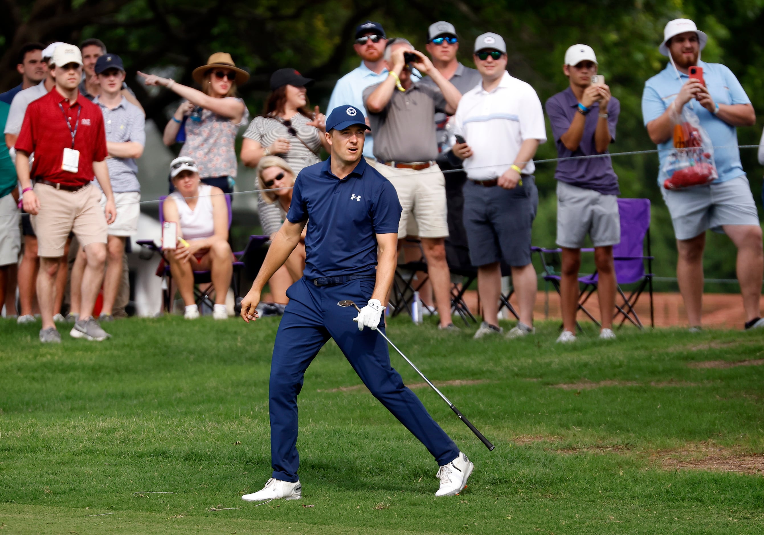 Professional golfer Jordan Spieth reacts after his approach shot from the No. 17 fairway...