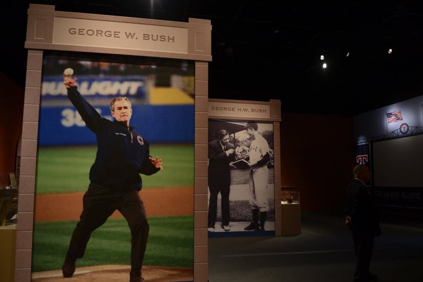  A photograph of President George W. Bush throwing the ceremonial first pitch at Yankee...
