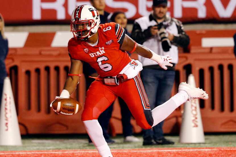 FILE - Utah running back Armand Shyne (6) scores as touchdown against Arizona in the second...