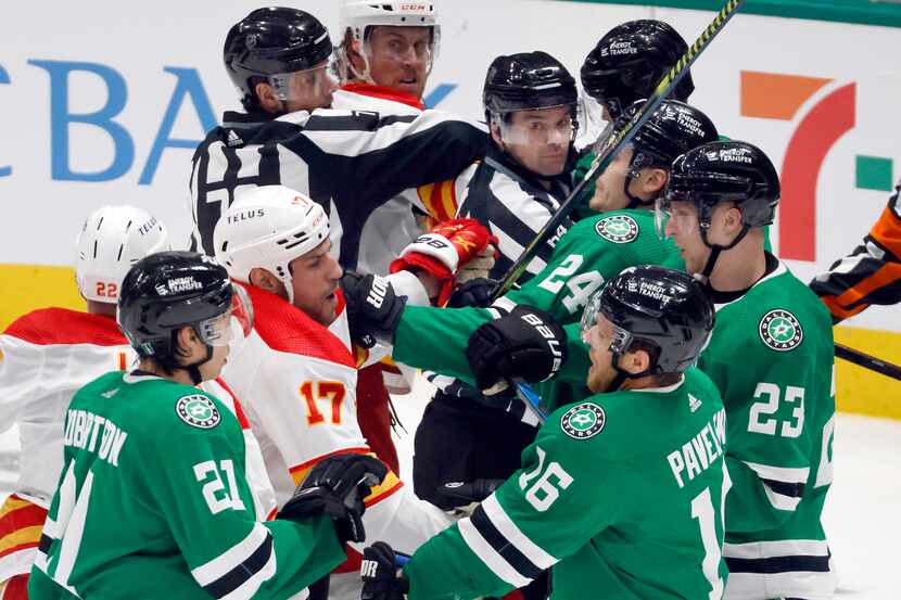 A scuffle with the Calgary Flames in front of the Dallas Stars net during the second period...