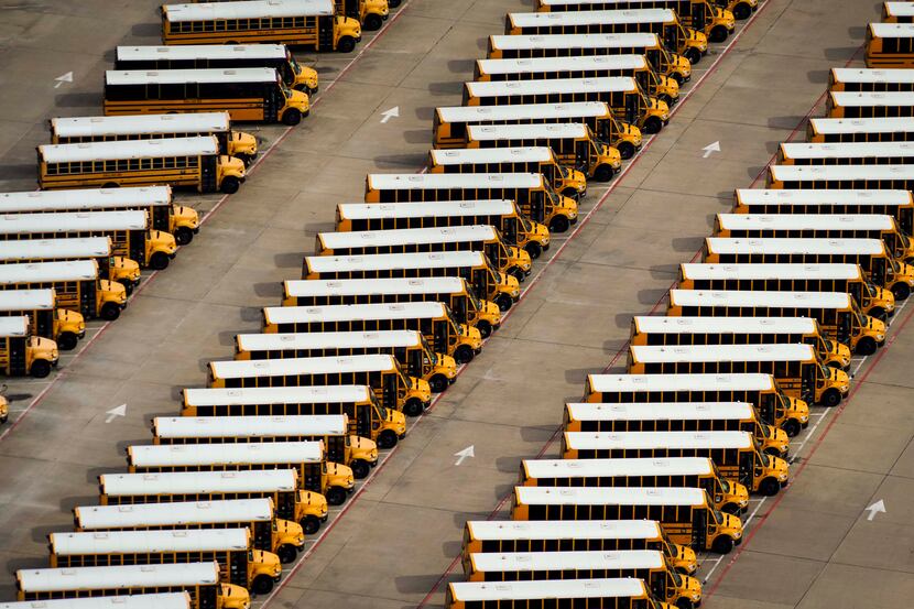 Aerial view of idle school buses at the Dallas ISD Student Transportation Services North...