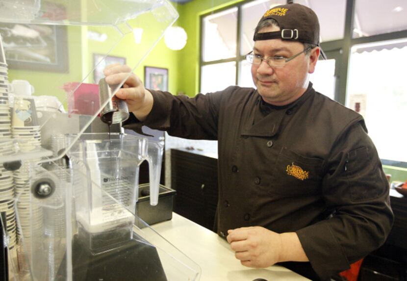Troy Easton, owner of Sublime Chocolate Bar in Allen, prepares to blend ingredients for...