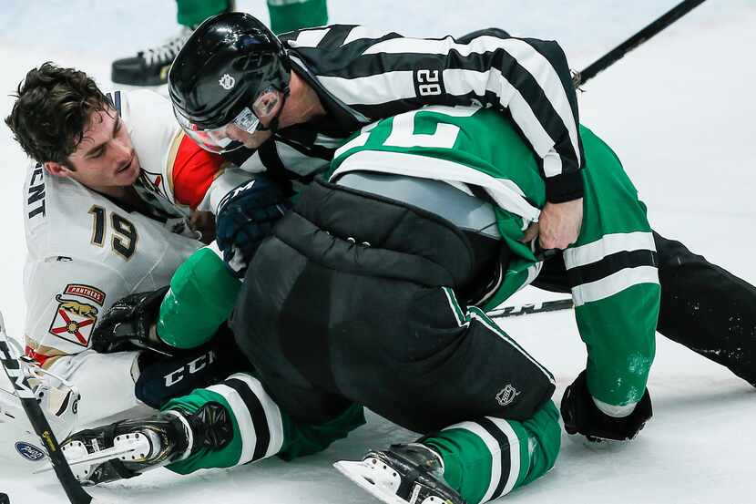 Dallas Stars forward Radek Faksa (12) and Florida Panthers forward Mason Marchment (19)...