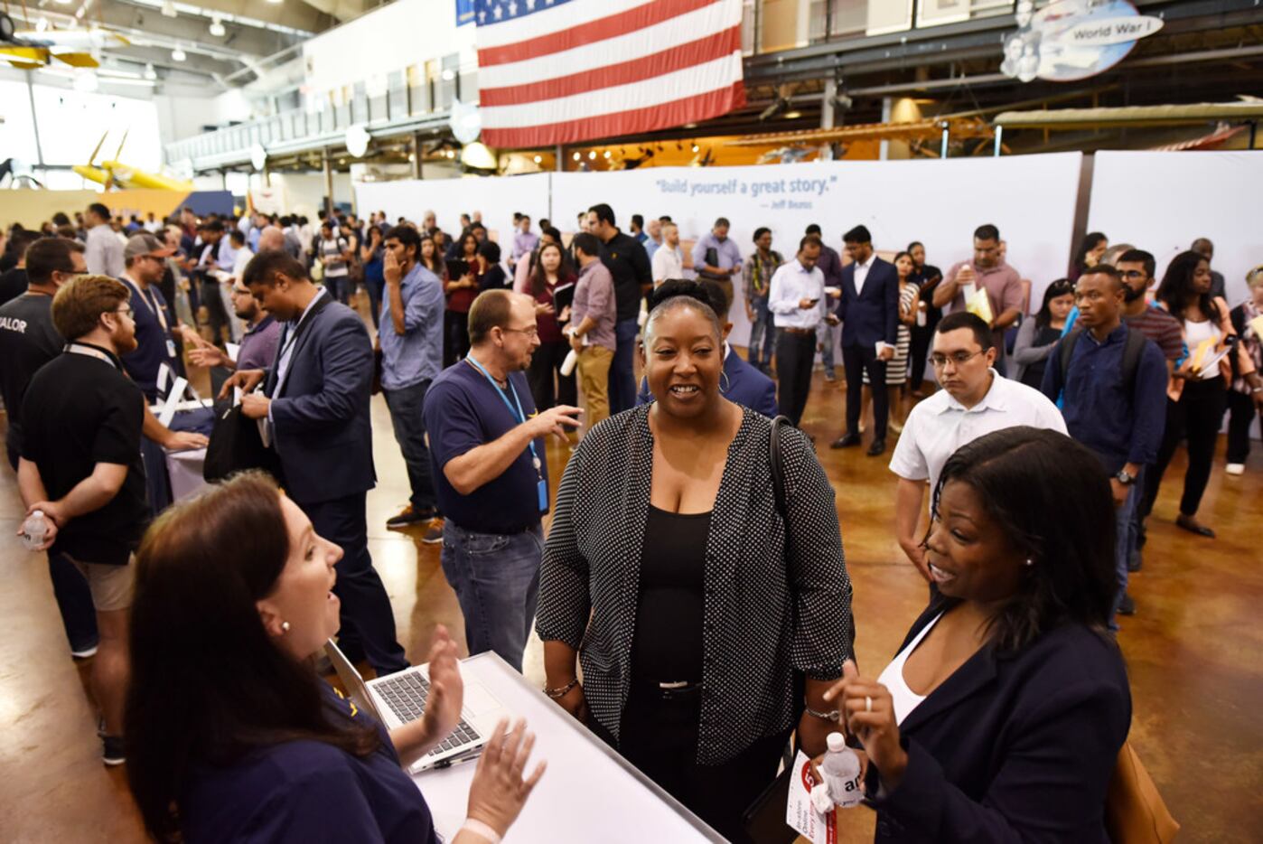 Lizzie Myers, left, an Amazon sales recruiter, speaks with Marie Wilson, 38, right, and...