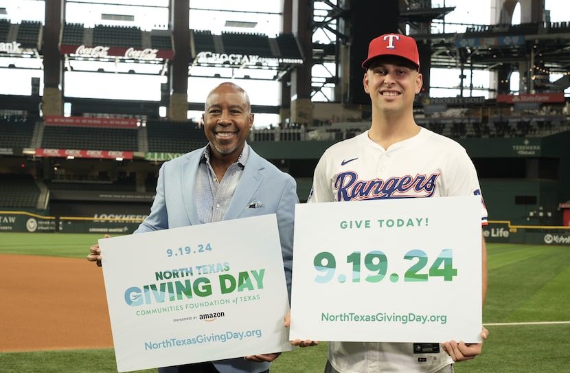 Texas Rangers first baseman Nathaniel Lowe stands with Communities Foundation of Texas...