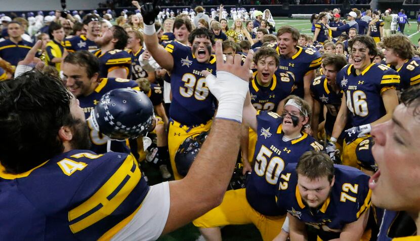 The Highland Park Scots celebrate their come-from-behind 42-35 win after the Highland Park...