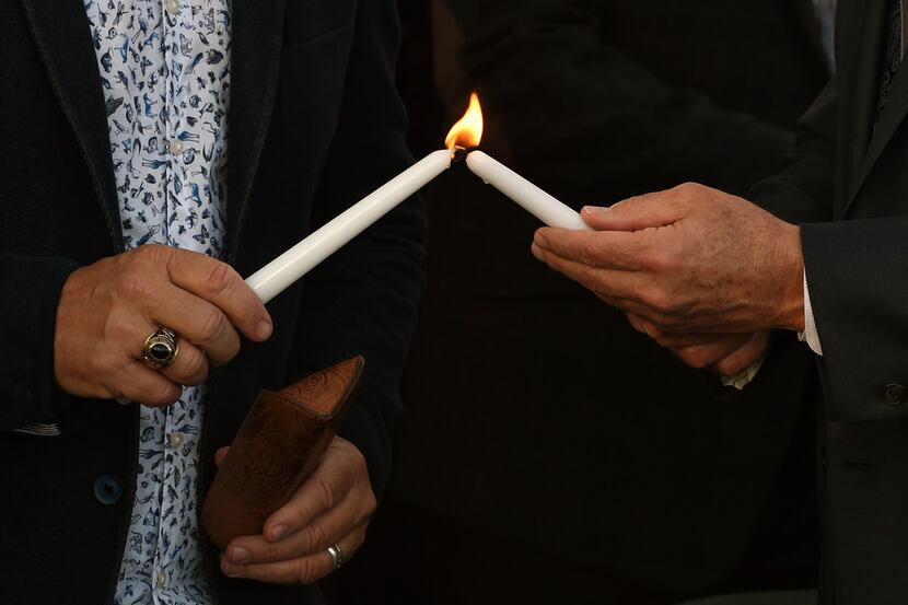The night after a mass shooting left more than 50 dead, victims were remembered at a prayer...