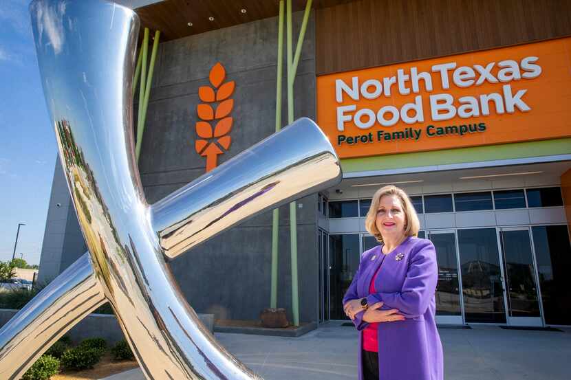 Trisha Cunningham, CEO and president of the North Texas Food Bank, stands next to a...