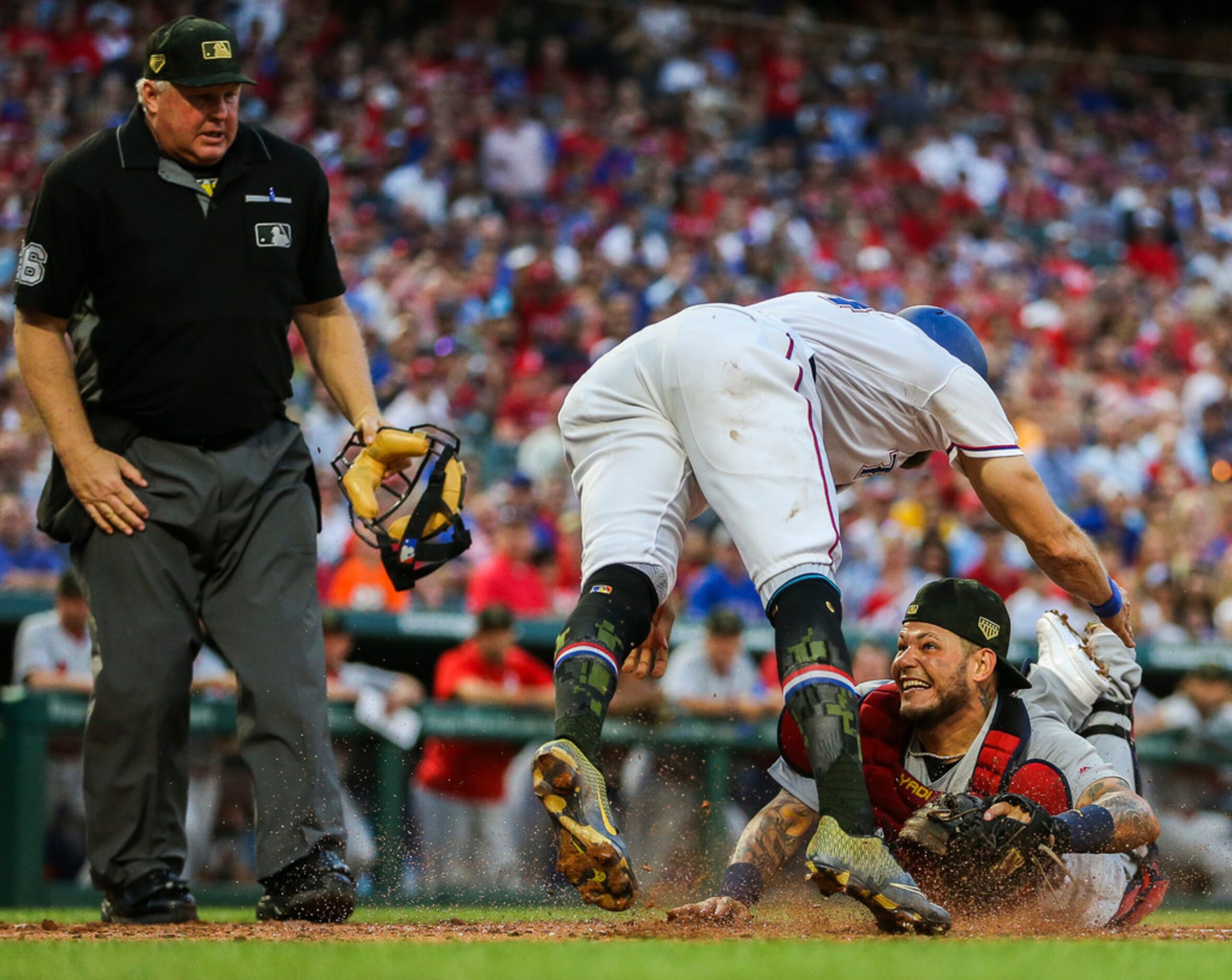 St. Louis Cardinals catcher Yadier Molina (4) tags out Texas Rangers designated hitter...