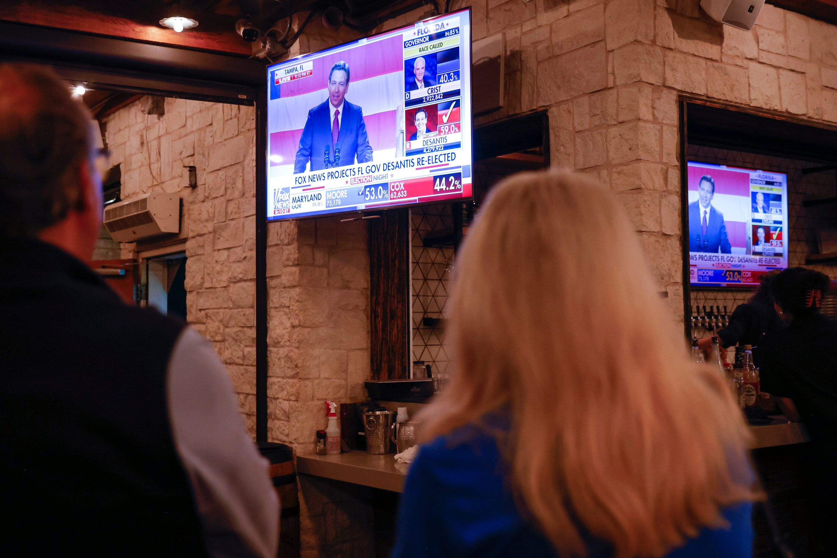 Supporters watch the speech of re-elected Florida Governor Ron DeSantis at Dallas County...