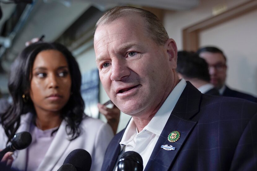 Rep. Troy Nehls, R-Texas, talks with reporters as he arrives for a House Republican caucus...