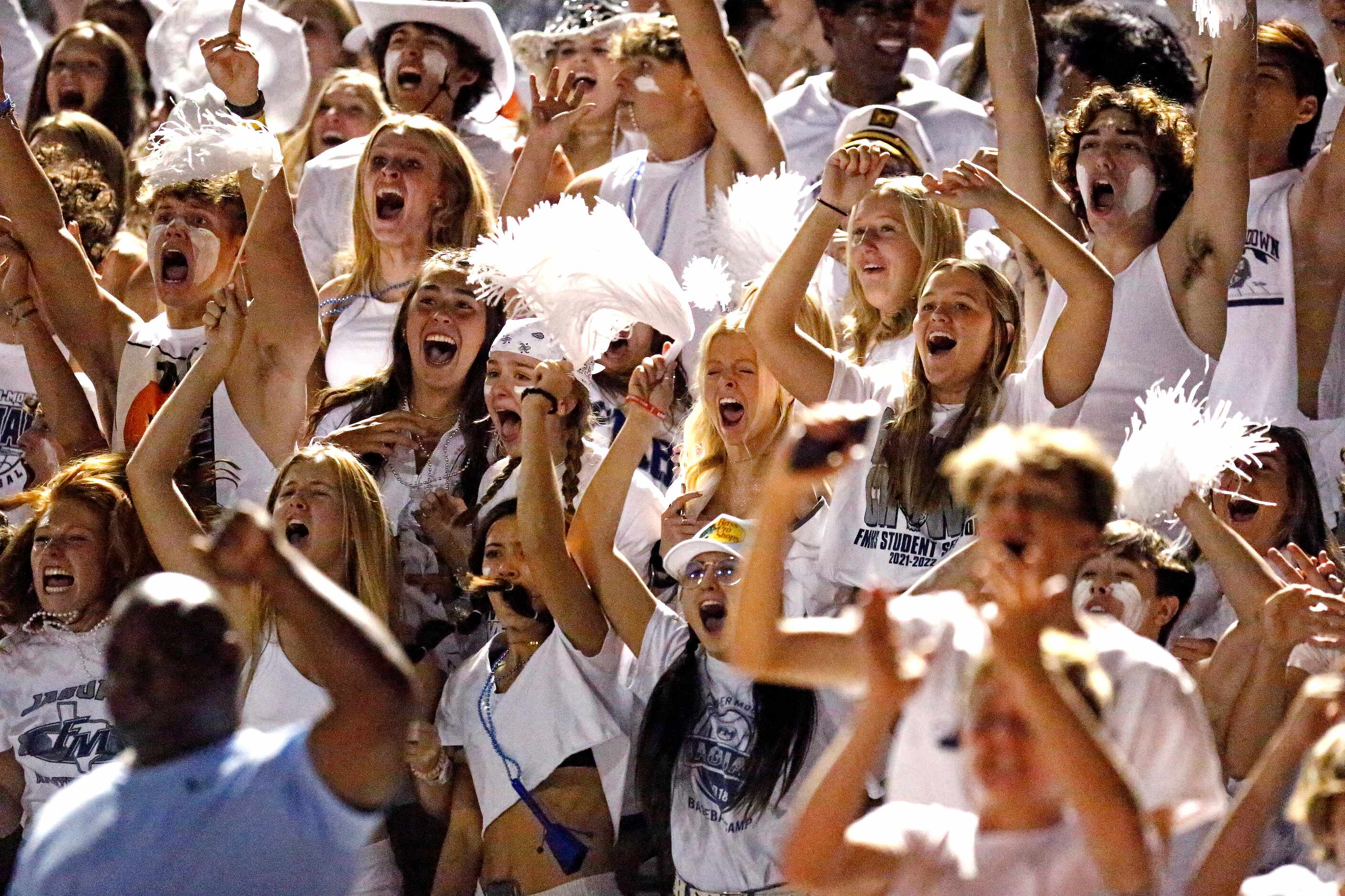 The Flower Mound High School student section reacts as their team goes ahead with a...