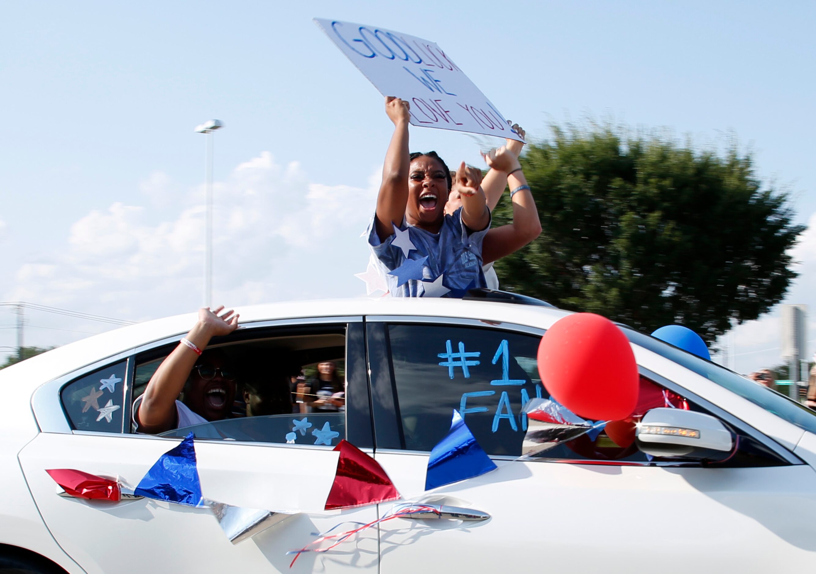 Supporters of Mansfield track star Jasmine Moore express their love and well wishes as part...