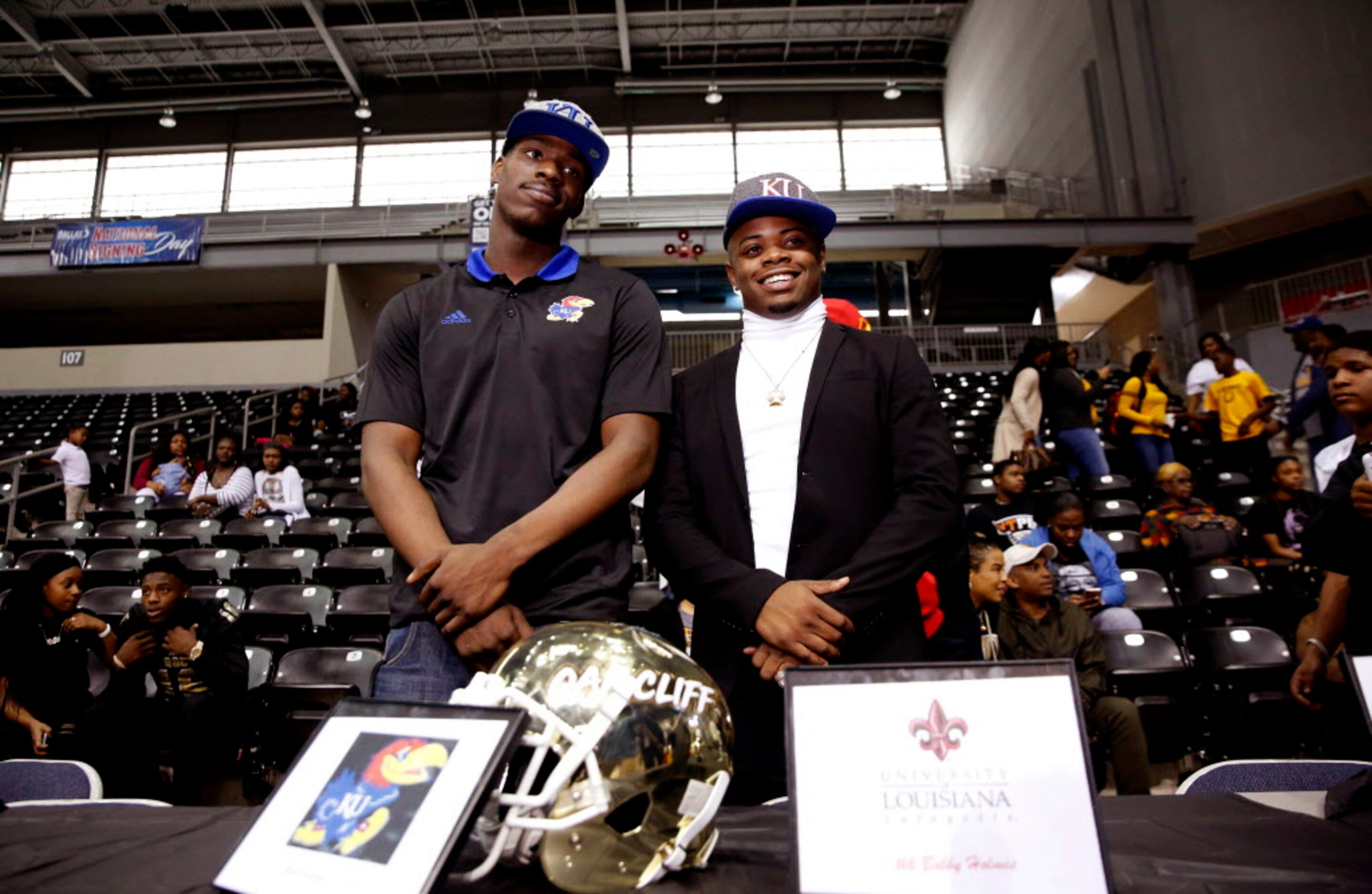 South Oak Cliff defensive lineman Steven Parker (left) and Skyline quarterback Velton...