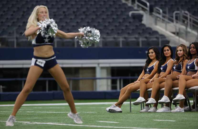 Dancers watches as others perform during the 2016 Dallas Cowboys Cheerleaders final...