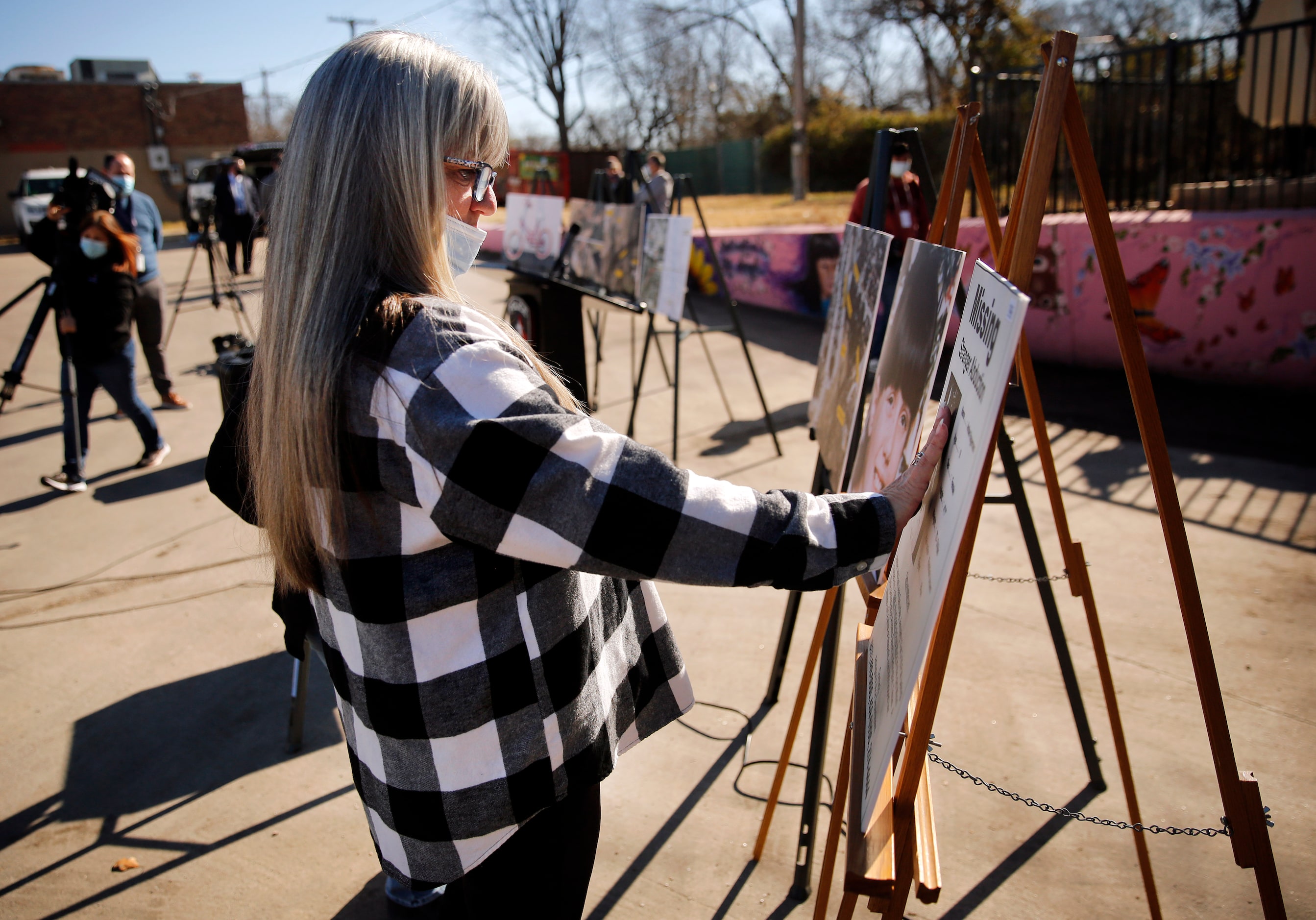 Amber Hagerman's mother Donna Williams touches a photo of her daughter on the original...