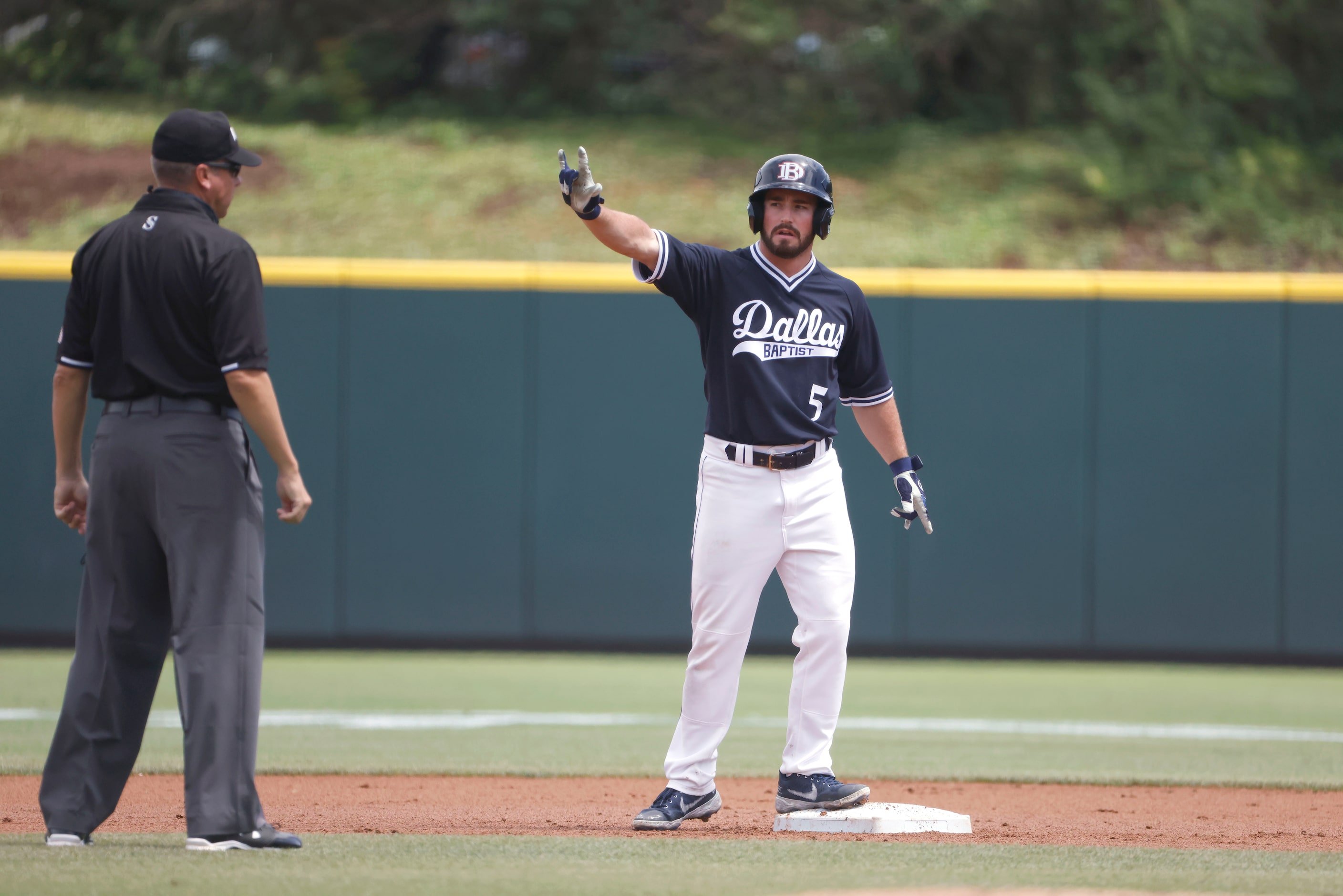 Dallas Baptist outfielder Austin Bell (5) reacts after hitting a double against Oregon St....