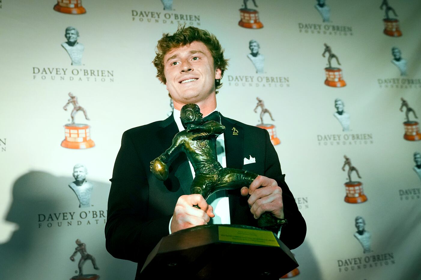 TCU quarterback Max Duggan holds the Davey O'Brien Award, given to College Football’s best...