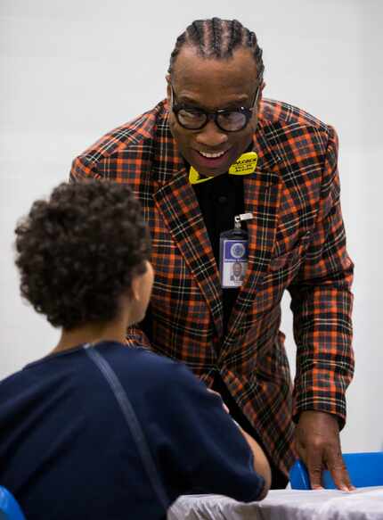 Dallas County Commissioner John Wiley Price talks with a juvenile inmate on the day the...