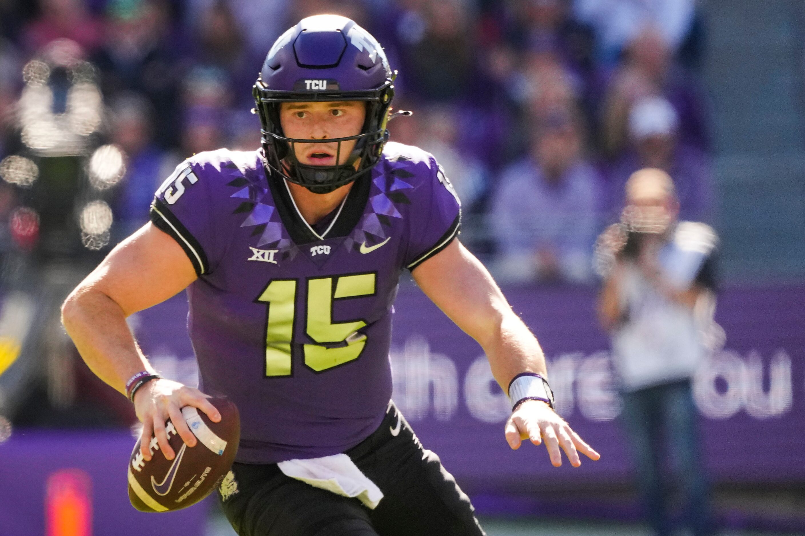 TCU quarterback Max Duggan scrambles during the first half of an NCAA football game against...