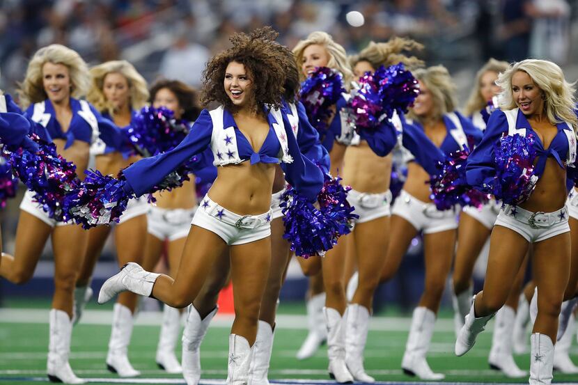 The Dallas Cowboys Cheerleaders perform before the game against the Dallas Cowboys at AT&T...