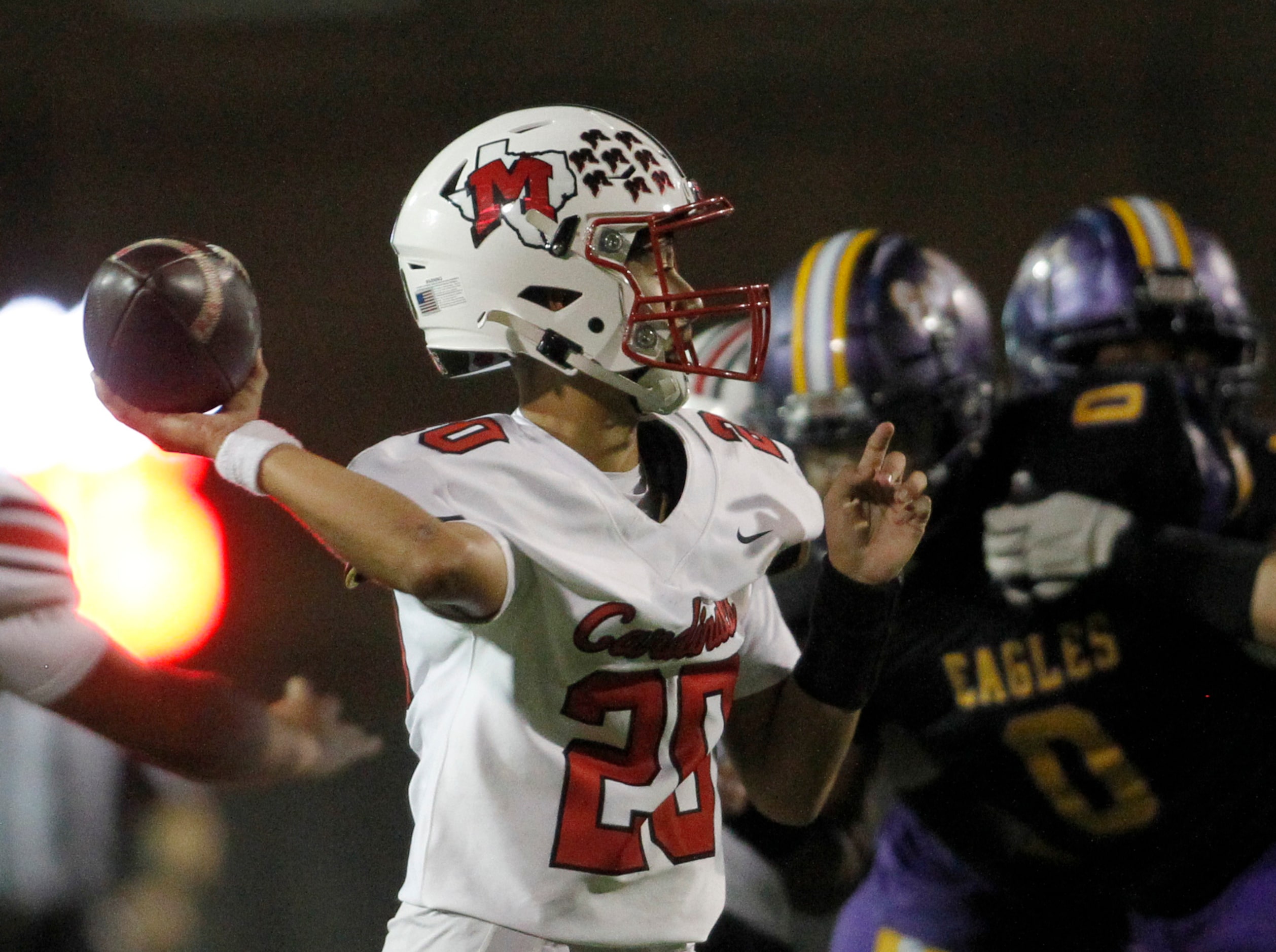 Irving MacArthur quarterback Brock Casas-Willis (20) delivers a pass during first half...