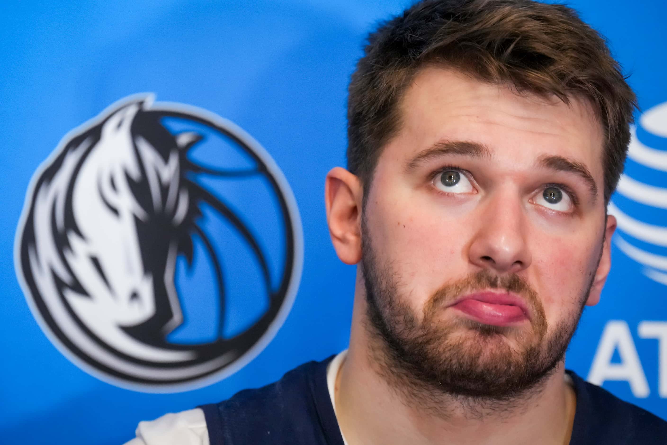 Dallas Mavericks guard Luka Doncic ponders a question he addresses reporters after the team...